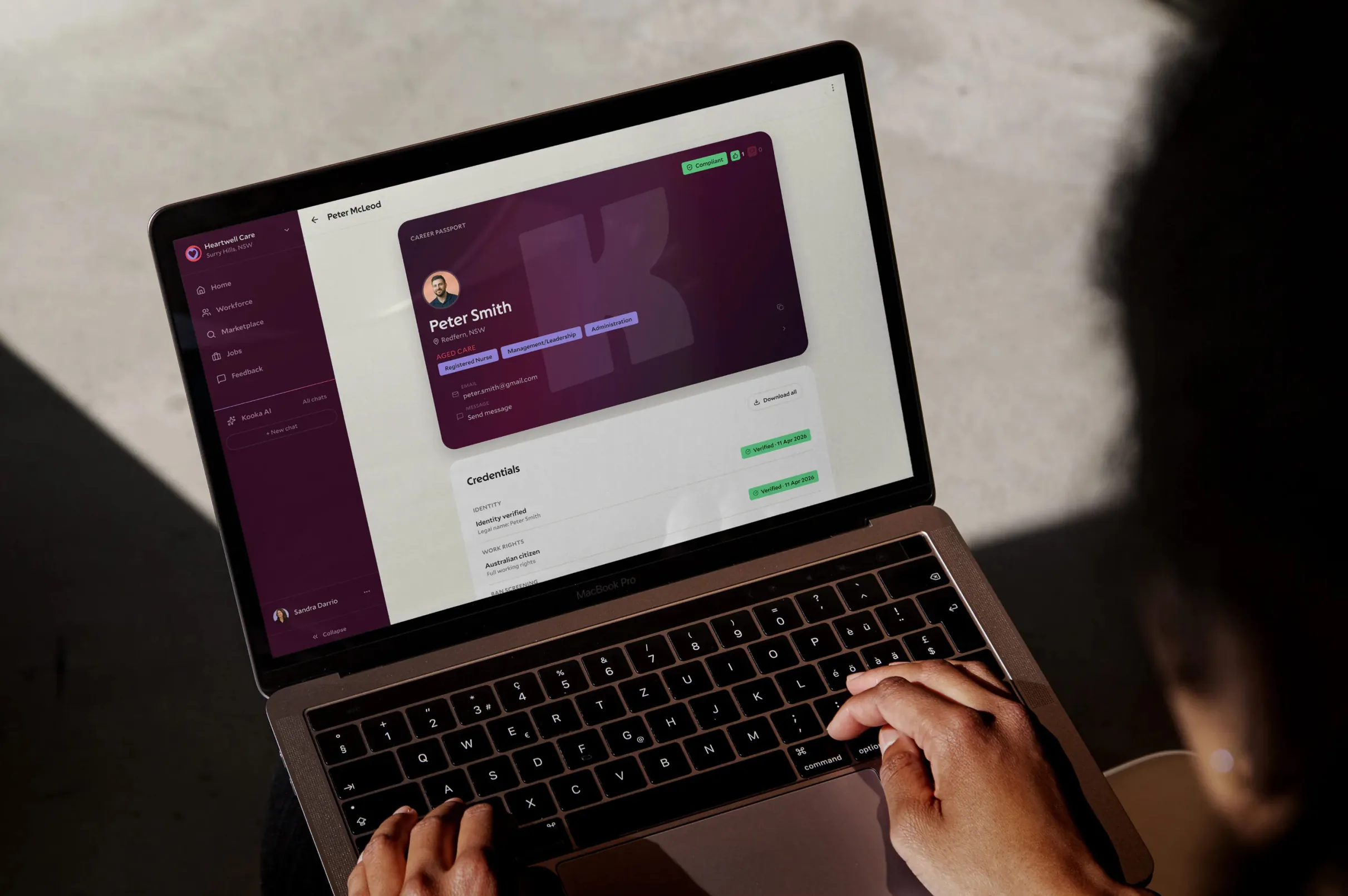 Care provider using Koora on a laptop