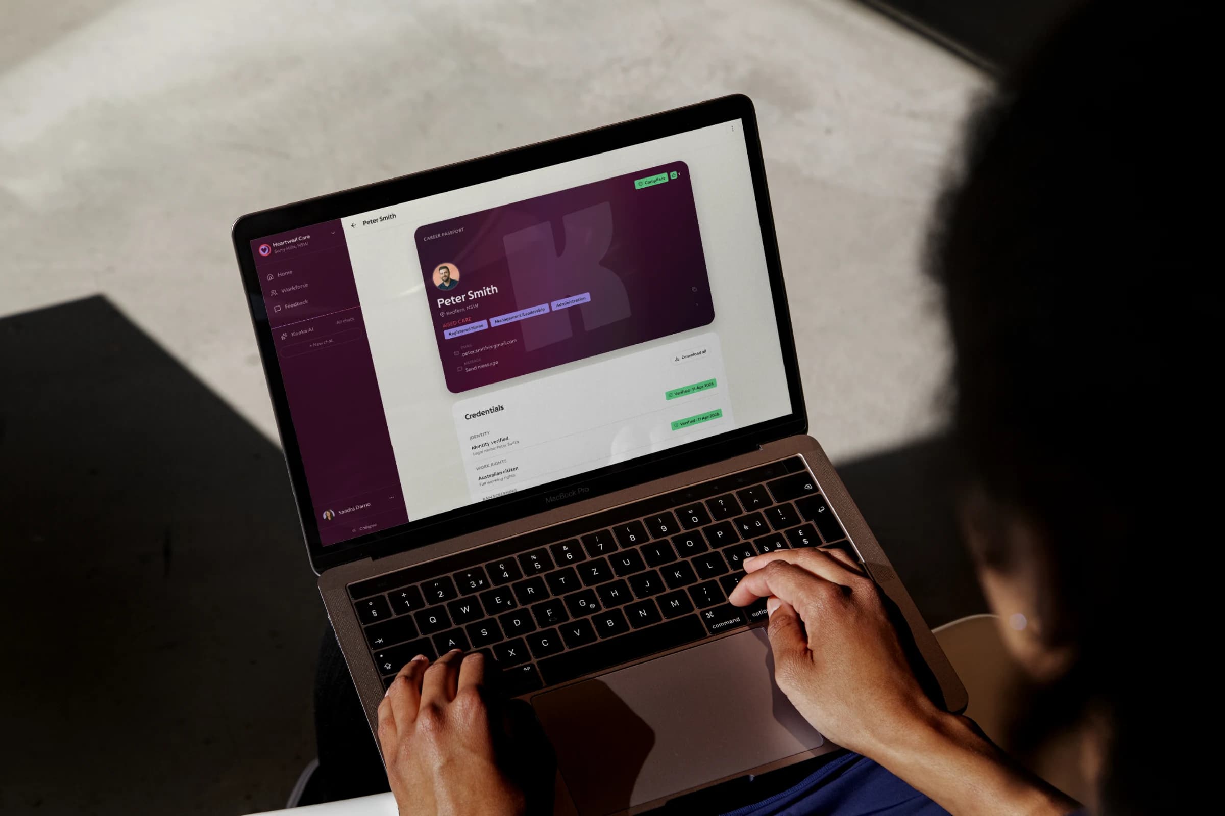 Care provider using Koora on a laptop